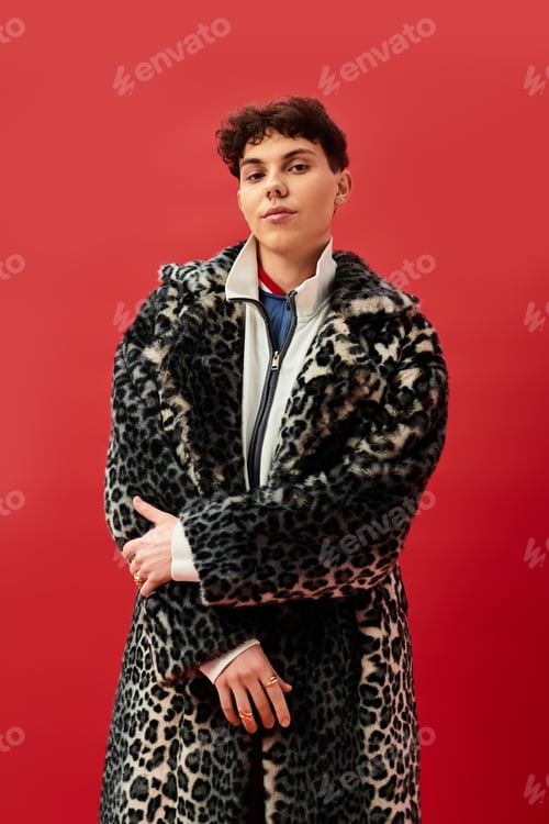Preview: Stylish man exuding confidence in a bold leopard print coat against a vibrant backdrop