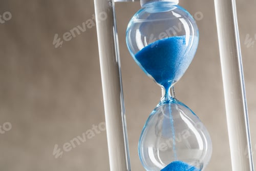 Preview: Close up hourglass on table