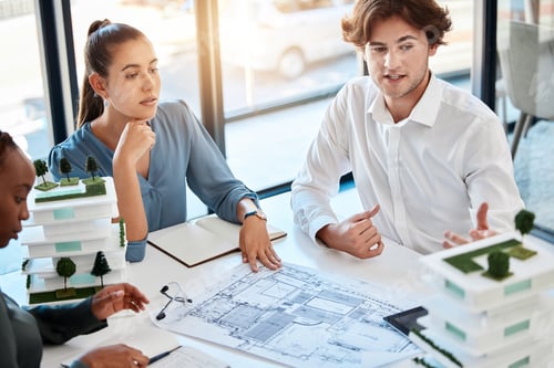 Preview: Team, architect engineer and planning building blueprint in meeting with logistics, diversity and t