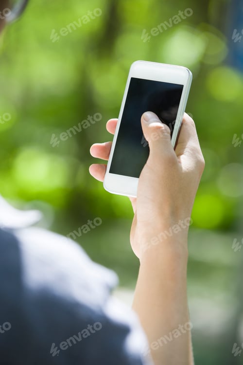 Preview: Young man using smart phone