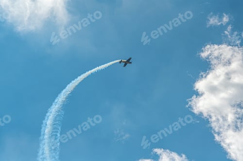 Preview: The aerobatic plane with smoke track in the sky