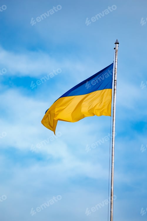 Preview: National flag of Ukraine against blue sky