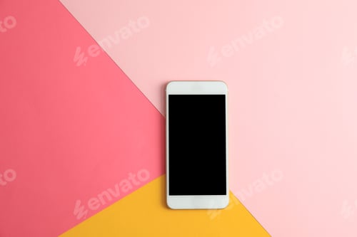 Preview: Modern phone on color background, top view. Space for text
