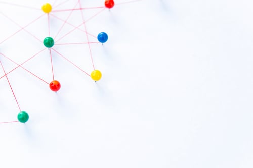 Preview: The connection between the two networks. Network simulation on paper linked together by yarn
