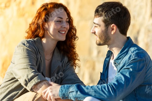 Preview: Close-up of happy couple smiling and holding hands outdoors. Lifestyle.