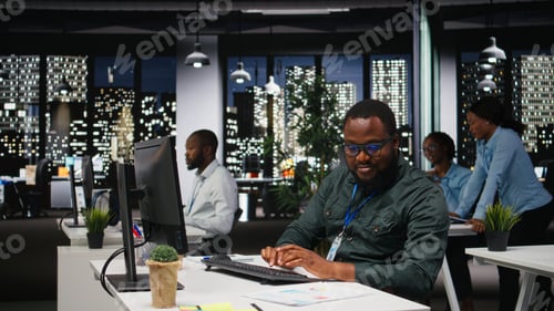 Preview: African american consultant engaged in planning and analysis with computer