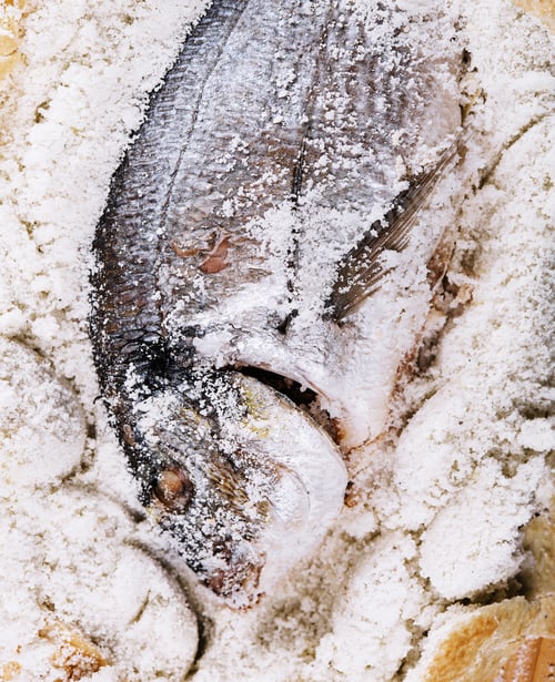 Preview: Preparing salt-baked dorada fish top view