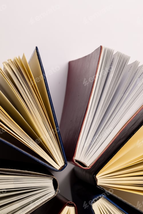 Preview: Image of central composition with books standing on white surface