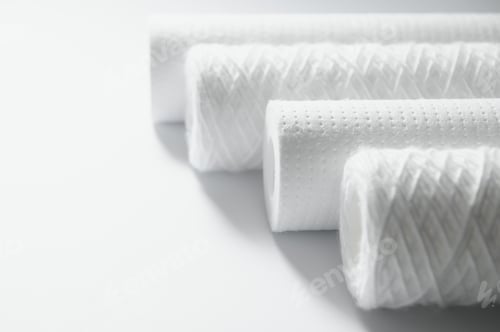 Preview: Cartridges for water treatment systems on white background.