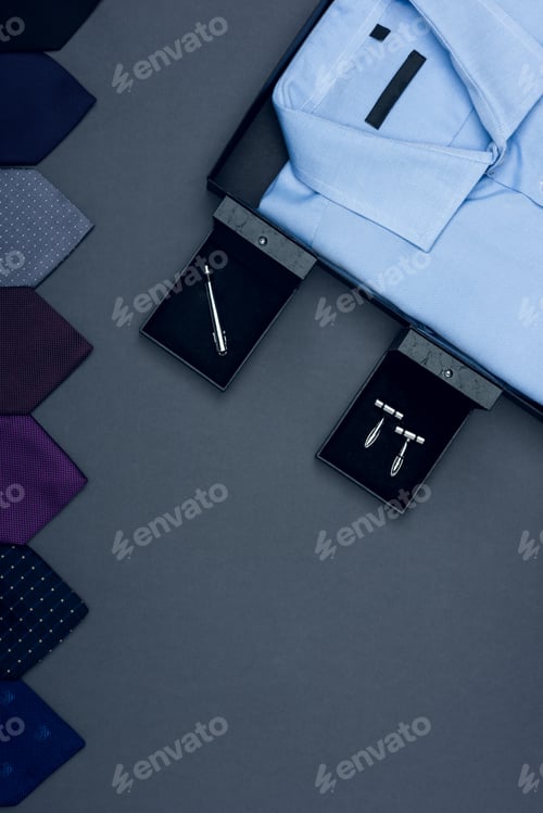 Preview: top view of shirt, arranged various neckties and cufflinks isolated on grey