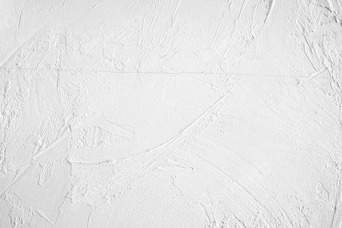 Preview: Textured white wall surface with subtle patterns and brush strokes