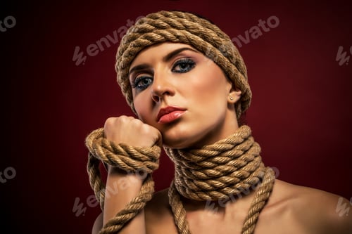 Preview: Portrait of a pretty young woman with ropes