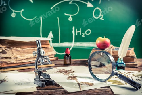 Preview: Old biology lesson in classroom on old wooden table