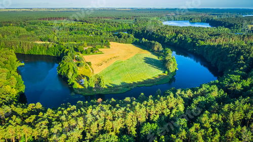 Preview: Blue winding river and green forests in summer