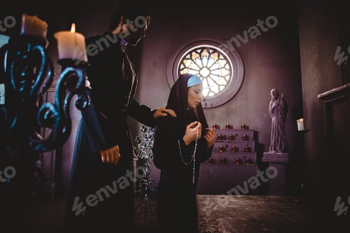 Preview: Nun and priest praying and spending time in the monastery