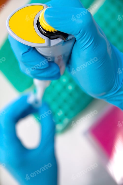 Preview: Pipette with drop of liquid in a science research lab