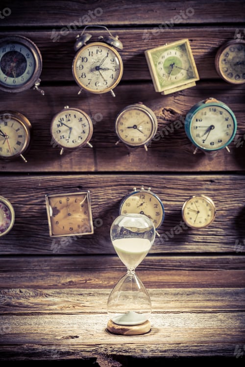 Preview: Hourglass on the background of clocks