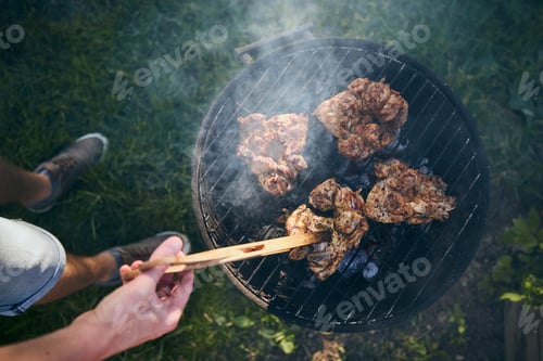 Preview: Grilling chicken meat on barbecue