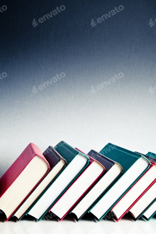 Preview: Red, black and green books in a library