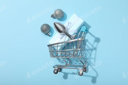 Preview: Metal butt plug with gifts on a blue background.