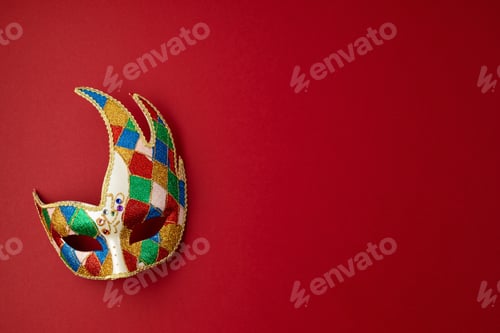 Preview: Festive, colorful mardi gras or carnivale mask and accessories over purple background