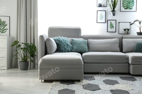 Preview: Comfortable large sofa in light room. Interior design