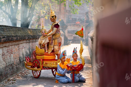 Preview: Asian man and woman with Thai old traditional dress stay together on traditional chariot