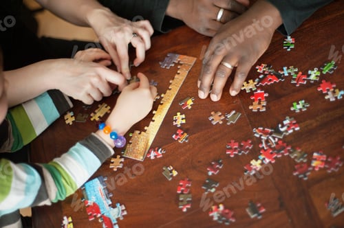 Preview: Cropped image of family solving jigsaw puzzle at table