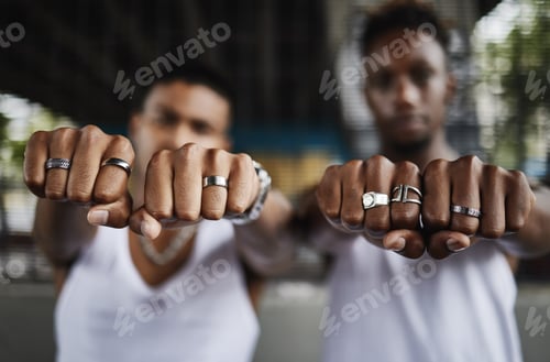 Preview: Closeup shot of two male gangsters hands showing off their rings with clenched fists