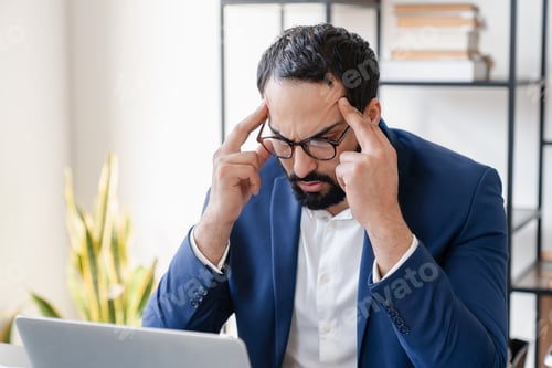 Preview: Concentrated serious pensive thoughtful tired stressed exhausted mature businessman working