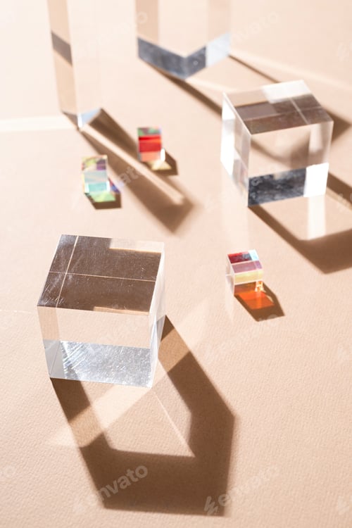 Preview: Glass prisms reflect light making beautiful shadows on beige background