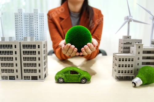 Preview: A young businesswoman works at a white desk with city buildings, solar cells, a wind turbine