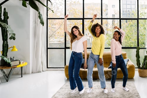 Preview: Three multiracial young women friends having party at home