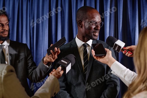 Preview: Businessman talking to journalists at press conference