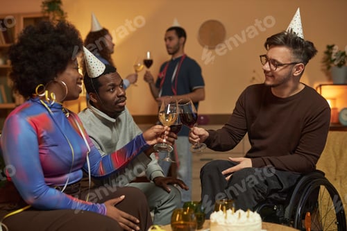 Preview: Inclusive Group of Friends Clinking Wine Glasses