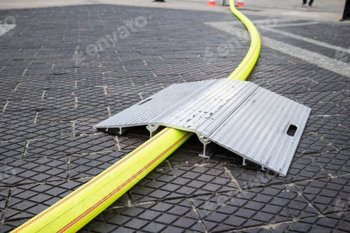 Preview: Metal bridge is designed to protect the fire hose from mechanical damage. Close-up.