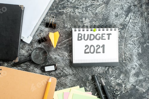 Preview: top view budget note with pens and notepads on gray background job copybook school student business