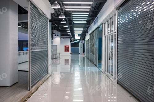 Preview: Abandoned corridor closed shutter shop in department store