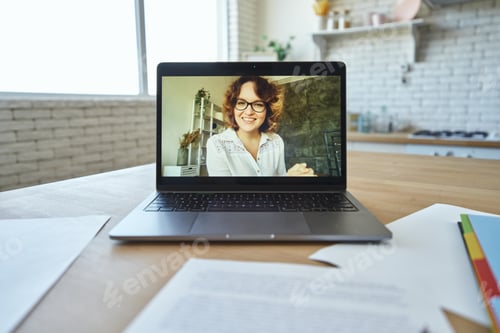 Preview: Woman on Laptop Screen During Virtual Meeting