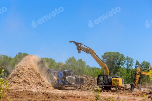 Preview: Using forestry mulcher, we loaded roots from trees to an industrial shredder machine that chopped a