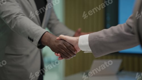 Preview: Business people shacking hands together showing successful contract agreement