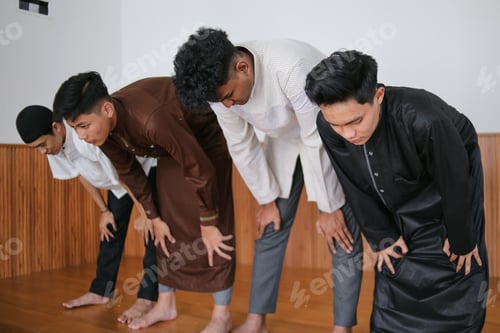 Preview: Group Of Muslim Worshipper Kneeling Posing Ruku Doing Salah Together At Mosque