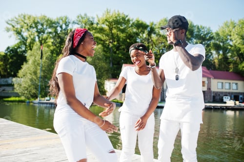 Preview: Stylish african american friends in white
