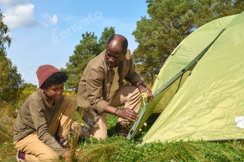 Preview: Father and His Kid Communicating in Forest
