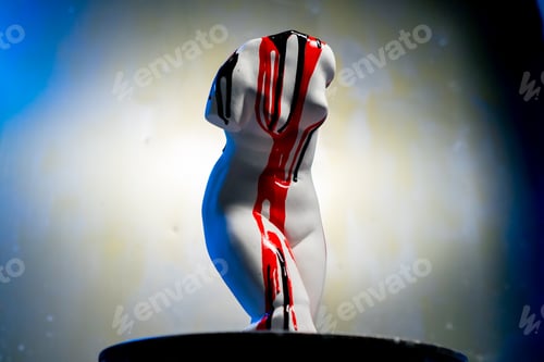 Preview: a white sculpture in the form of a body standing a barrel a museum exhibit covered in various paints