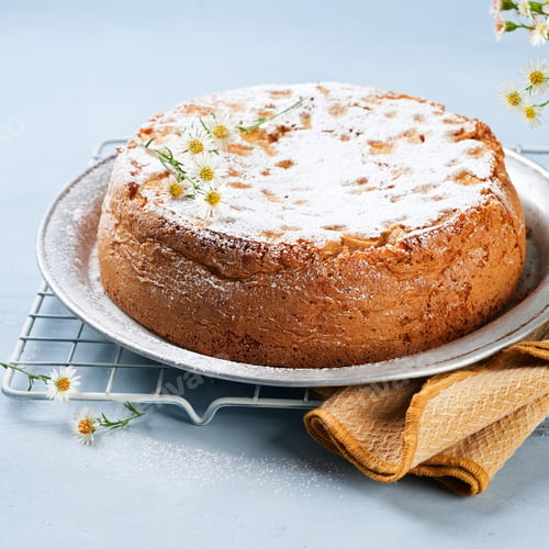 Preview: Healthy Wholemeal apple cinnamon tea cake on light blue background with copy space.