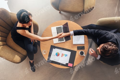 Preview: Business colleagues shaking hands on deal