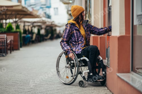 Preview: Woman with disability using credit card and atm machine