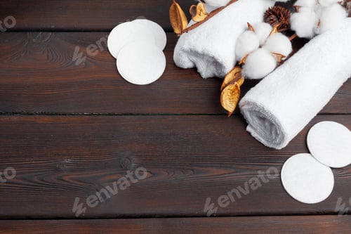 Preview: Cotton flowers with towel on wooden table