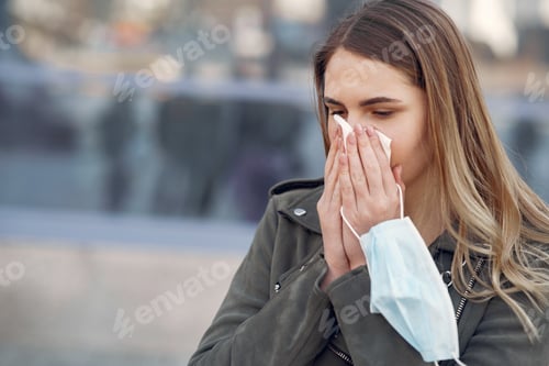 Preview: Woman in a mask stands on the street